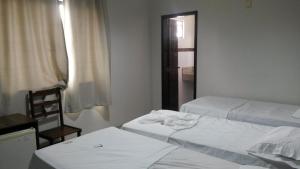 Postel nebo postele na pokoji v ubytování Hotel Ferrari + 8 fotografií