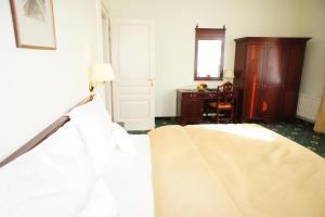 Posteľ alebo postele v izbe v ubytovaní Hotel Mignon