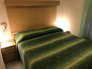 Postel nebo postele na pokoji v ubytování Hotel B&B Rispescia Grosseto