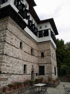 a building with balconies on the side of it at Mansion Karagiannopoulou in Vizitsa