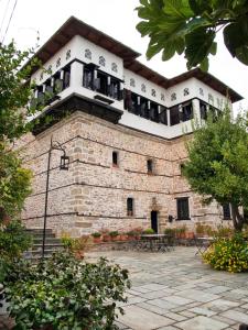 a building with balconies on top of it at Mansion Karagiannopoulou in Vizitsa