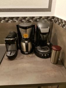 a coffeemaker and a coffee maker on a counter at Gites Spa Strasbourg - Gite le 14 in Furdenheim
