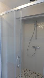 a shower with a glass door in a bathroom at Le Semoir in Bény-sur-Mer +15 photos