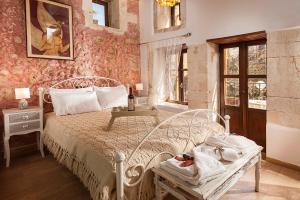 Posteľ alebo postele v izbe v ubytovaní Hamam Suites Sifaka