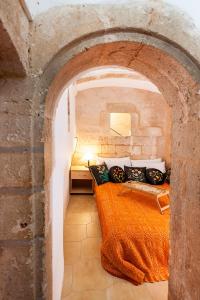 Posteľ alebo postele v izbe v ubytovaní Hamam Suites Sifaka