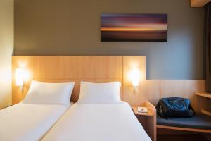 Letto o letti in una camera di ibis Rotterdam Vlaardingen