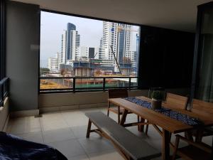 a room with a table and a view of a city at 126 Beacon Rock in Durban