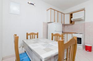 Kuchyň nebo kuchyňský kout v ubytování Apartments Mime