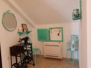 a room with a sink and a table and chairs at Villa Look in Tivat