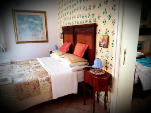 Кровать или кровати в номере B&B Villa Floriana
