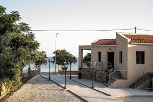 a house with a view of the ocean at Mais Studios in Vatera