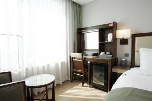 Postel nebo postele na pokoji v ubytování Stanford Hotel Busan