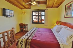 Кровать или кровати в номере Hosteria Sirenuse
