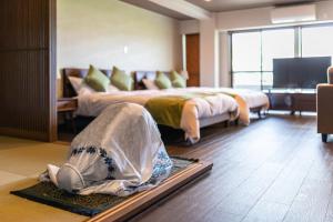 Katil atau katil-katil dalam bilik di Kyoto Riverview House Kyoraku