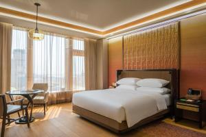 Voodi või voodid majutusasutuse MGM Cotai toas