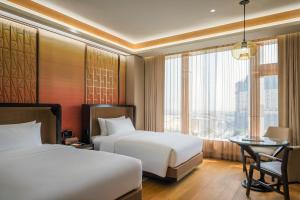 Voodi või voodid majutusasutuse MGM Cotai toas