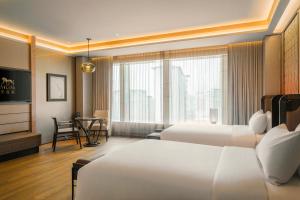 Voodi või voodid majutusasutuse MGM Cotai toas