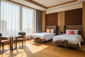 Voodi või voodid majutusasutuse MGM Cotai toas