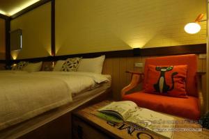 Postel nebo postele na pokoji v ubytování Qing Xin Ju Homestay