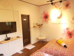 Kama o mga kama sa kuwarto sa Guiju Lin Garden Homestay
