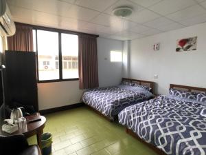 Ένα ή περισσότερα κρεβάτια σε δωμάτιο στο Zhongxing Hotel