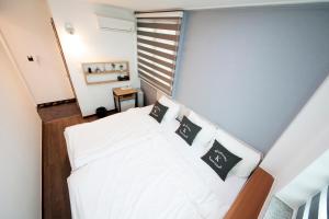 Krevet ili kreveti u jedinici u okviru objekta K-Guesthouse Dongdaemun