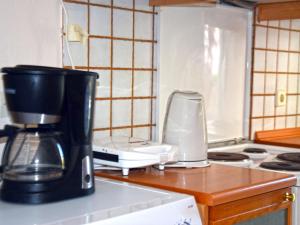 a coffee maker sitting on top of a kitchen counter at Siviri Rental Houses in Siviri