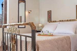 A bed or beds in a room at Omalos Gianni's House