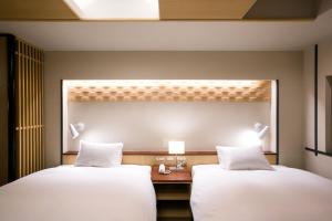 Rúm í herbergi á Kyoto Kamanza Hotel +37 myndir