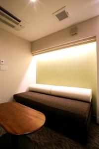 Rúm í herbergi á Kyoto Kamanza Hotel