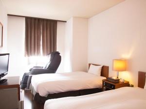 Un pat sau paturi într-o cameră la Hotel Abest Nagano Ekimae