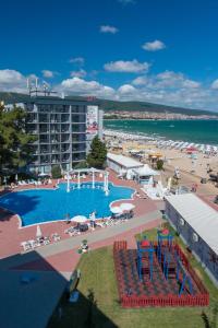 a swimming pool with a beach and a resort at Platinum Hotel & Casino in Sunny Beach