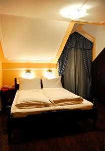 Krevet ili kreveti u jedinici u okviru objekta Hotel Evropa