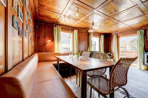 a dining room with a table and chairs at Appartement Walserstuba by A-Appartments in Brand