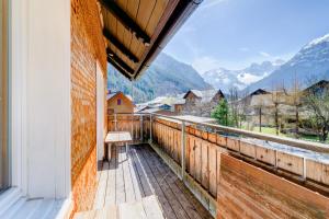 a balcony with a view of the mountains at Appartement Walserstuba by A-Appartments in Brand