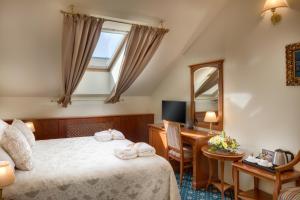 Postel nebo postele na pokoji v ubytování Boutique Hotel Seven Days