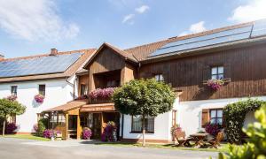 a building with solar panels on top of it at Pension Sommer in Waldsassen