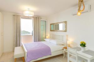 Posteľ alebo postele v izbe v ubytovaní Dubrovnik Colors - Old Town View Apartment No3
