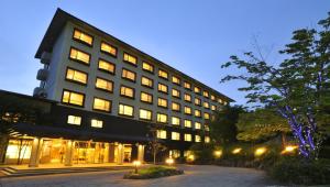 a large building with lights in front of it at Hotel Laforet Nasu in Nasu