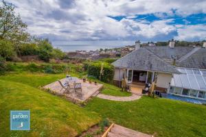 an aerial view of a house with a yard at The Garden Studios in Budleigh Salterton