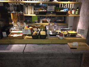 a kitchen counter filled with lots of food at ibis budget Tarbes in Tarbes