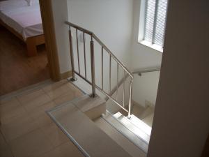 a staircase in a room with a bed at Holiday home >Nikola< Brijesta in Brijesta