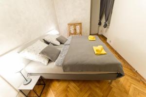 Posteľ alebo postele v izbe v ubytovaní Babylon Apartmány
