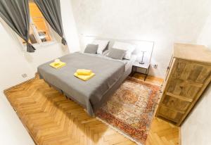 Posteľ alebo postele v izbe v ubytovaní Babylon Apartmány