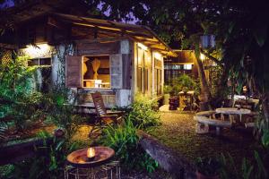 a small house in a garden at night at Cabinthai in Mae Chaem