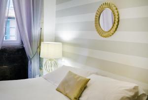 A bed or beds in a room at Inicia Casas Reales