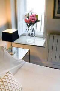 A bed or beds in a room at Inicia Casas Reales