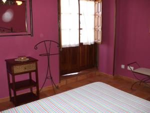 Łóżko lub łóżka w pokoju w obiekcie Apartamentos La Corraliza