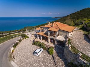 an aerial view of a house with a car parked in front at Nireas : Stone Villa in Zakynthos
