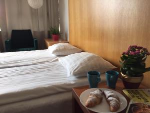 Postel nebo postele na pokoji v ubytování Arkadia Hotel & Hostel
